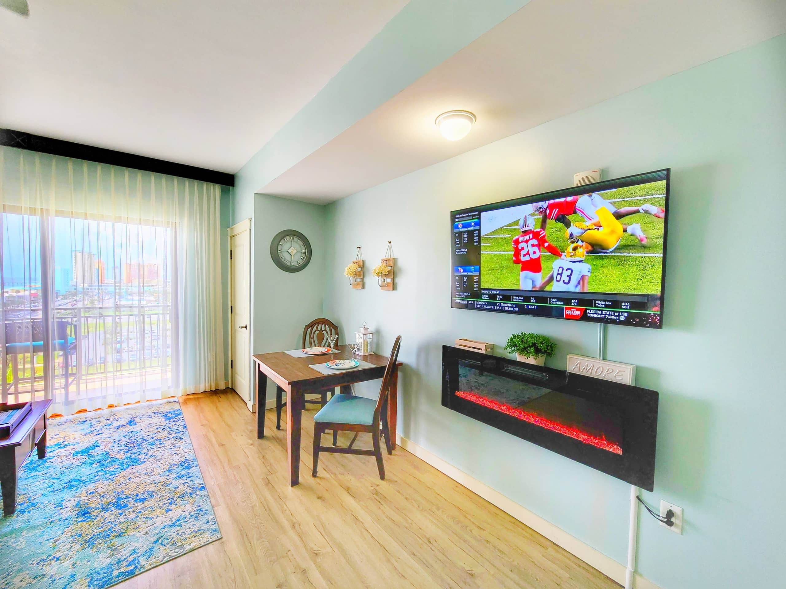 Big TV and Cozy electric fireplace for romantic evenings. Origin 805, Origin at Seahaven.